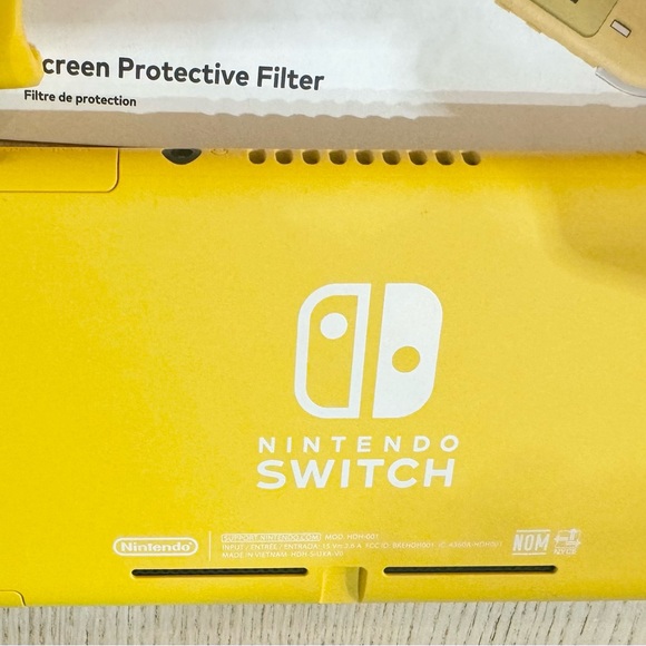 Nintendo Switch Lite with case, screen protector, original charger, & two games. - Picture 3 of 3